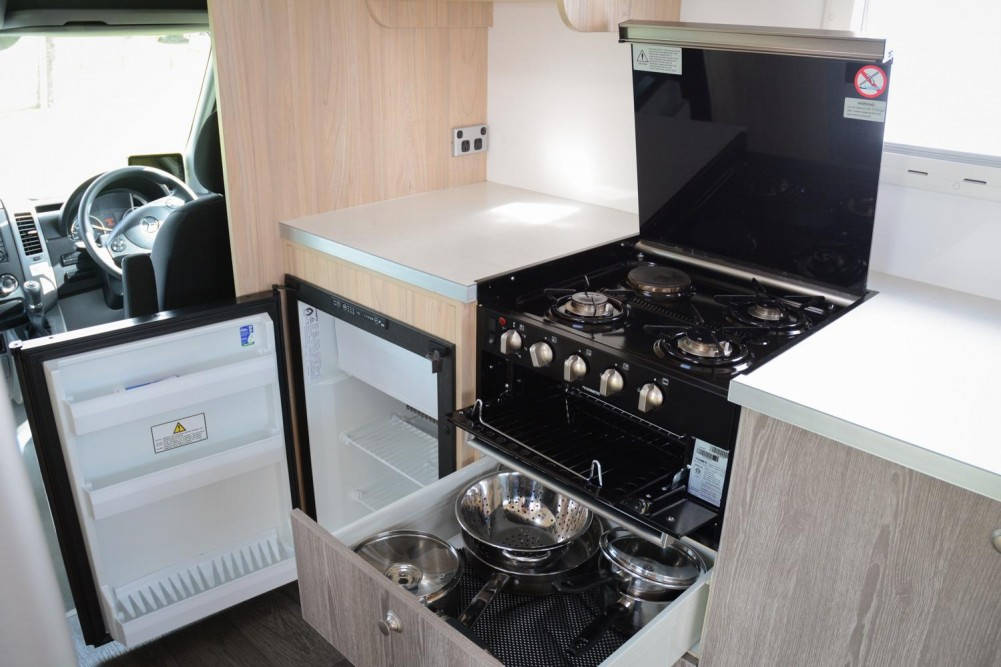 Pacific Horizon Motorhomes Campervan hire rental 4 berth Mercedes Kitchen area with 3-way automatic fridge & Gas cooker/grill